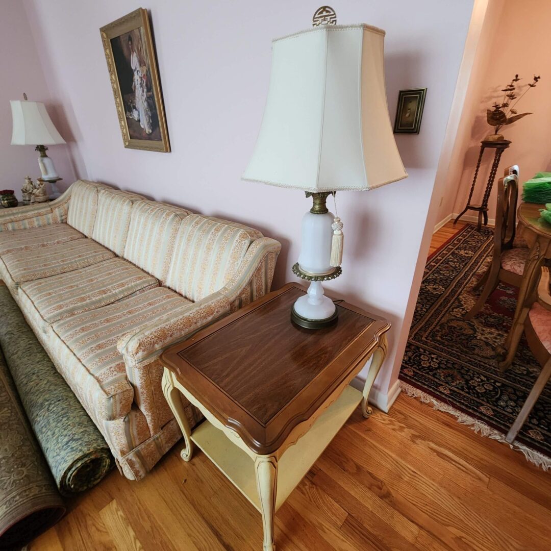 A Living Room With a White Color Sofa