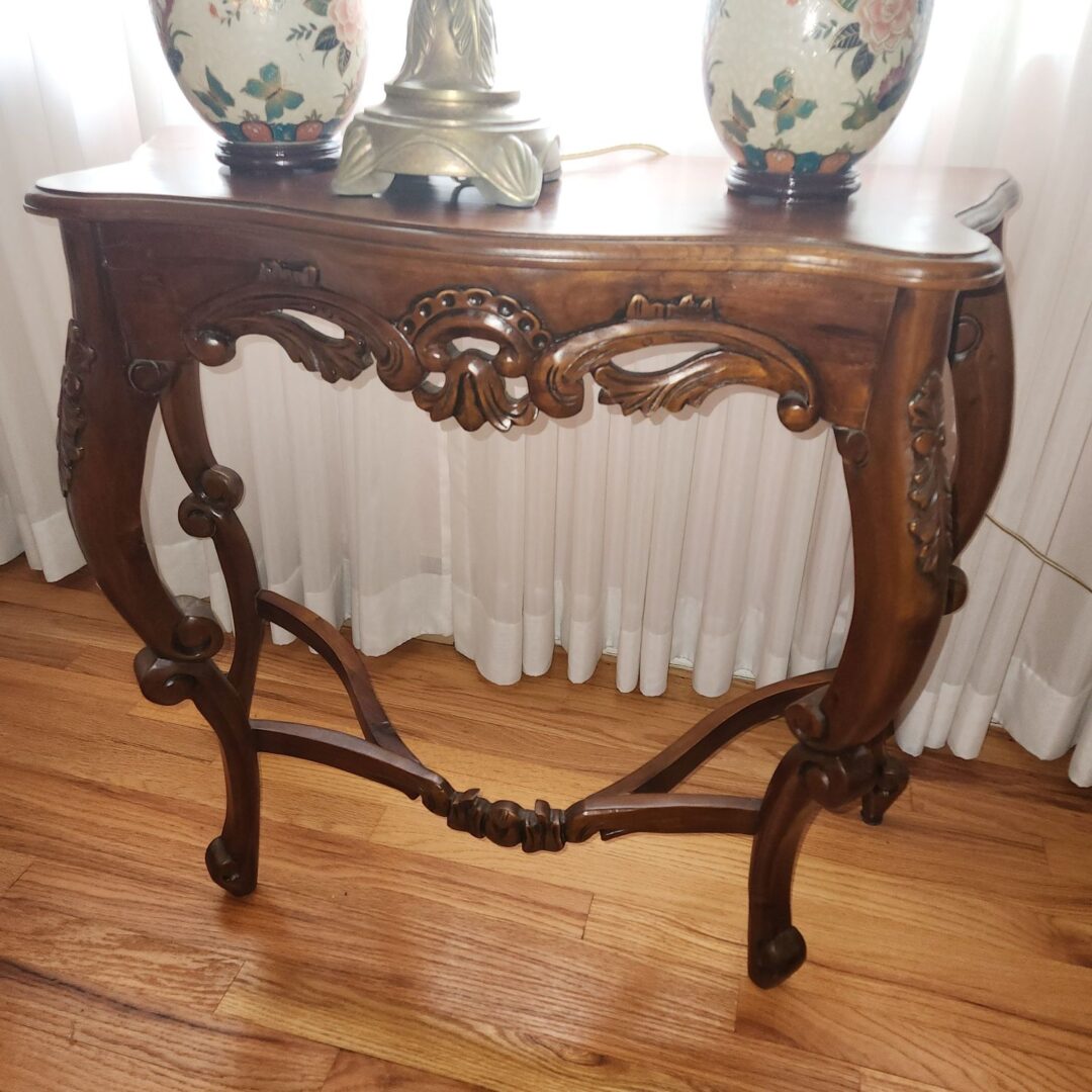 An Ornate Vintage Wooden Table in Display