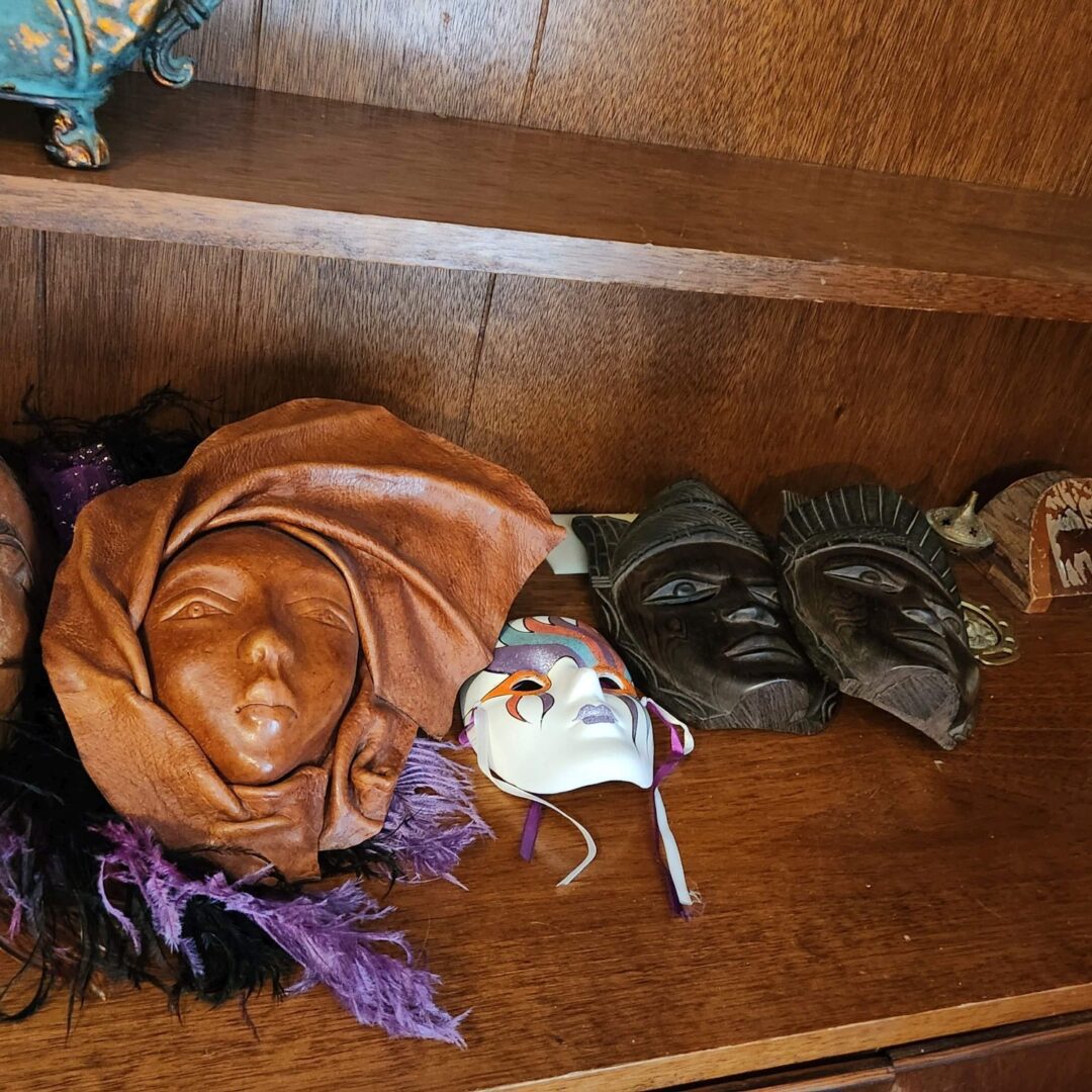 Masks of Different Color and Types Laid on a Shelf