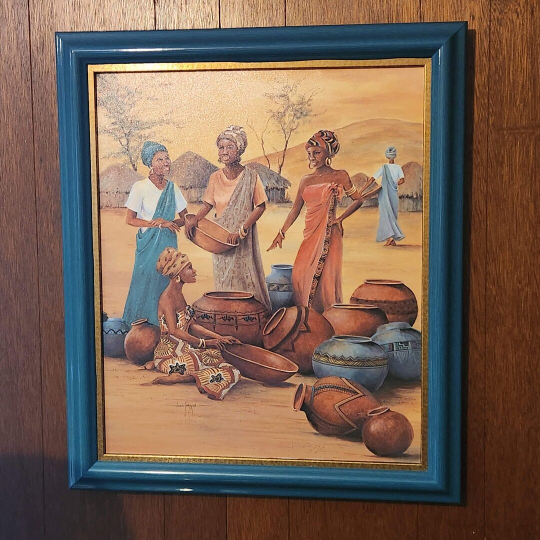 A framed painting of african women with pots