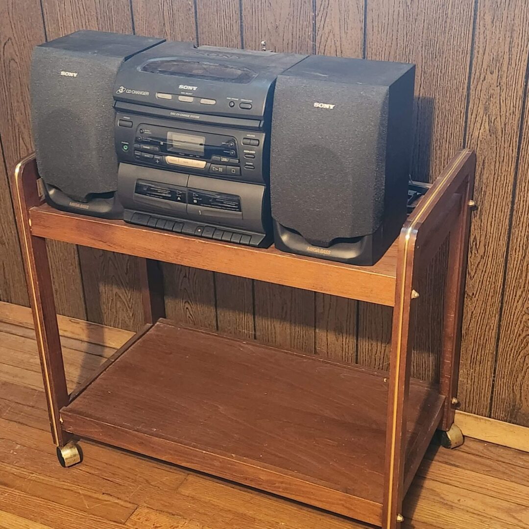 An Old Music System With Two Big Speakers