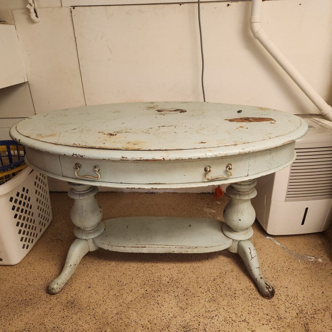 A White Color Wooden Table With Two Legs