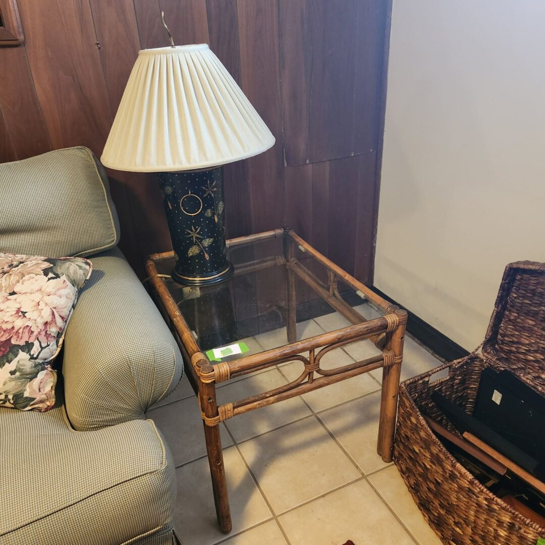 A White Color Lamp Shade on a Cane Table