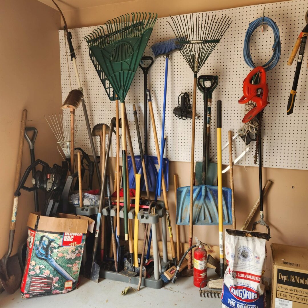 A garage full of gardening tools and equipment