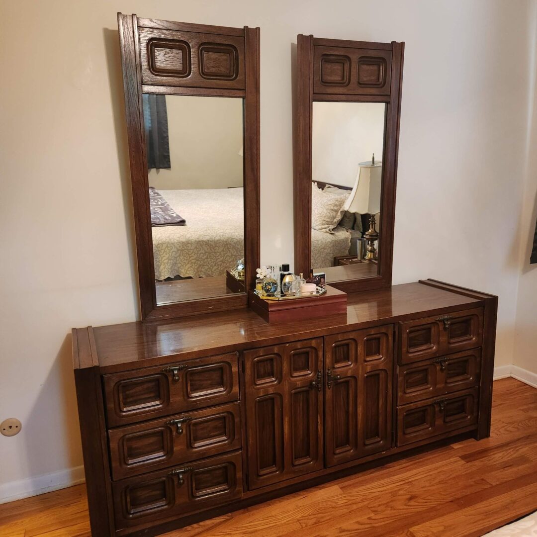 Two Large Wooden Dressers Placed Side by Side