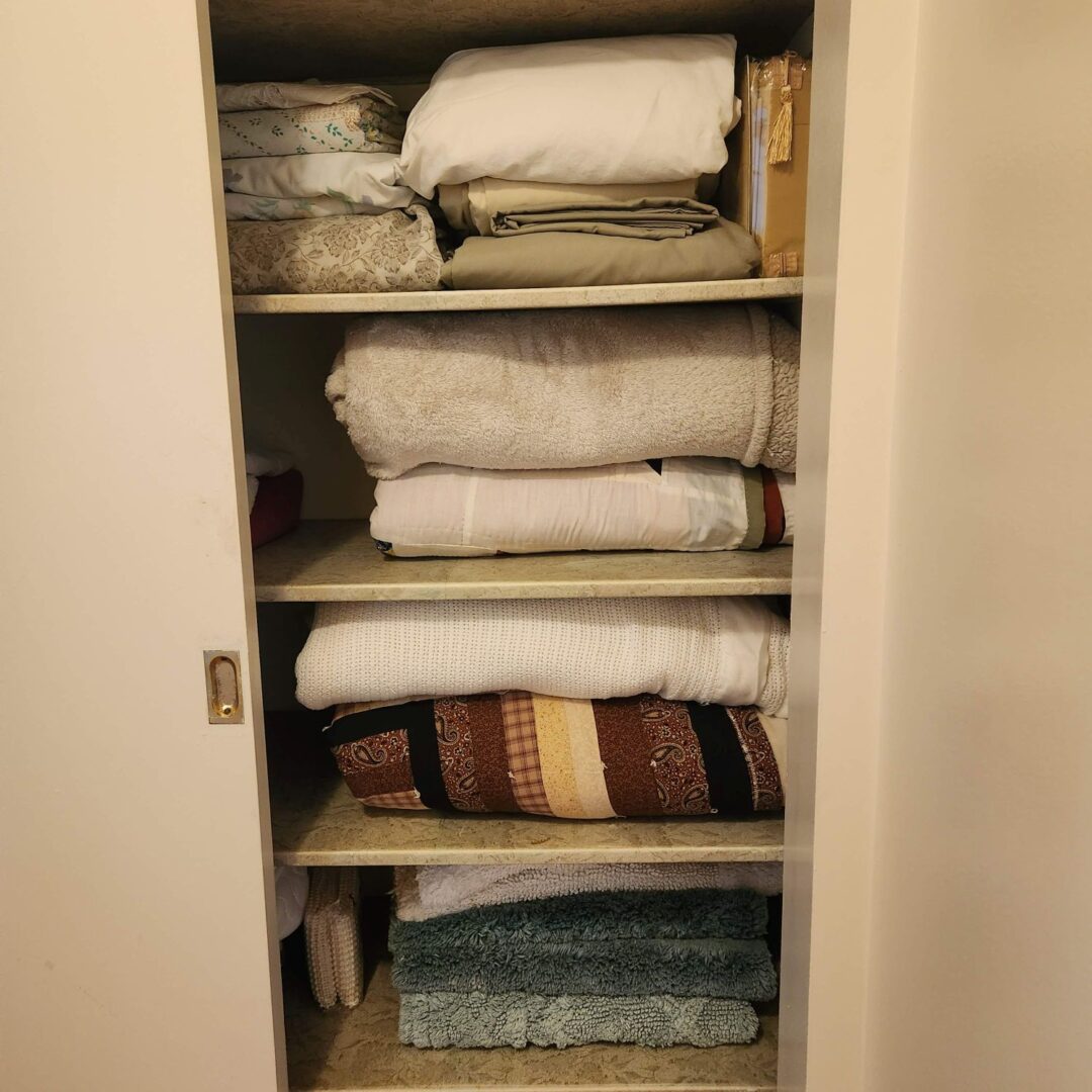 A closet full of towels and sheets